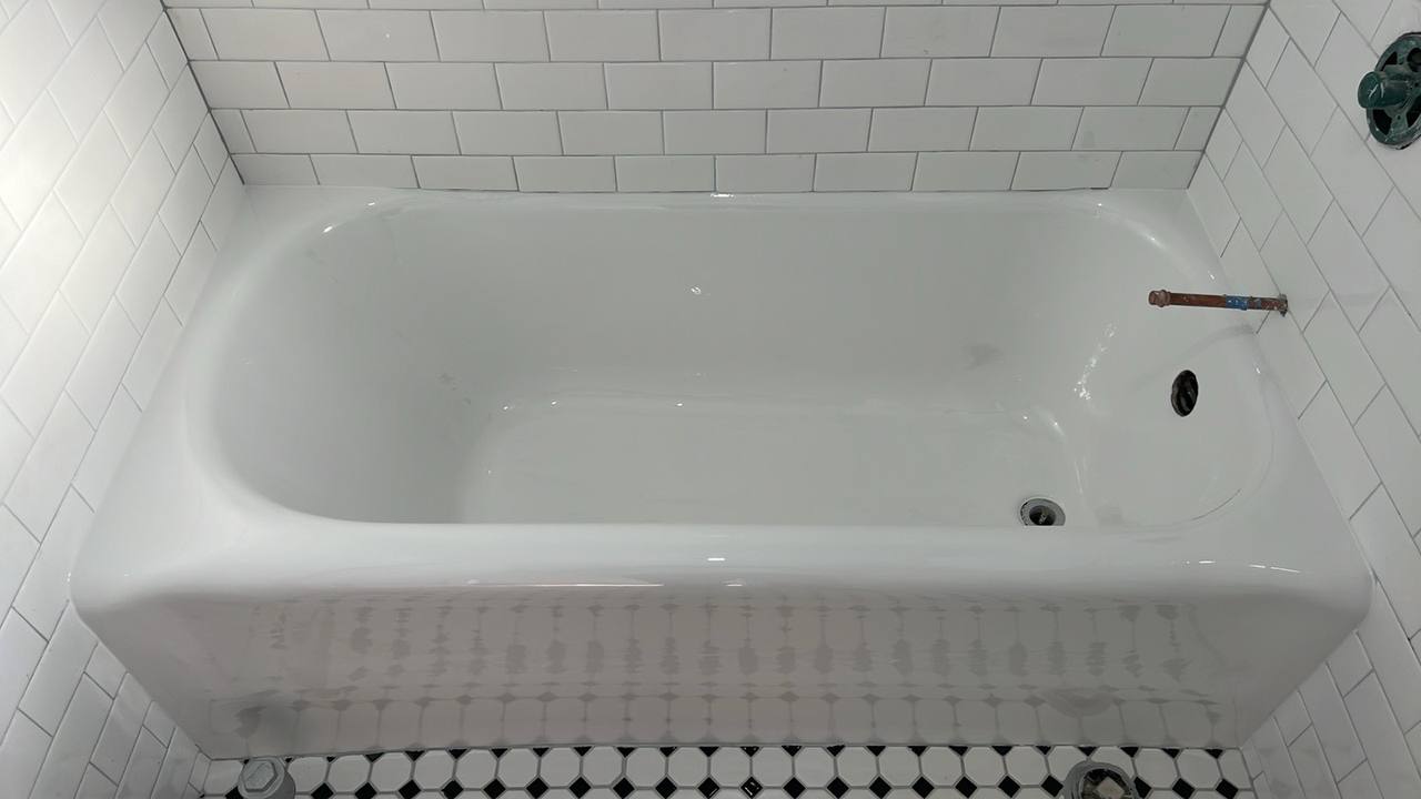 Completely restored gleaming white bathtub after professional refinishing by Fresh Tub in Los Angeles