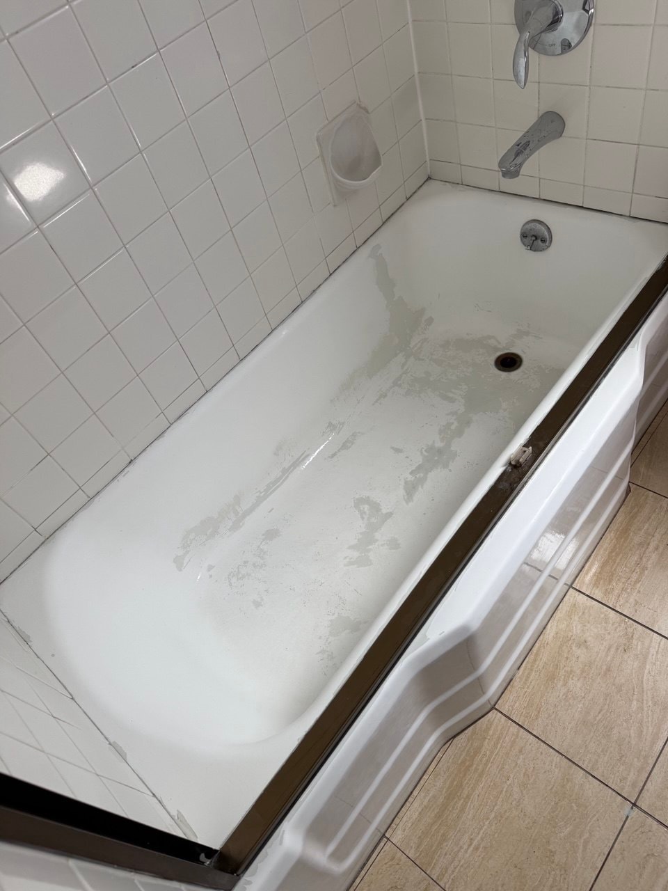 Peeling finish inside the bathtub before the Encino project