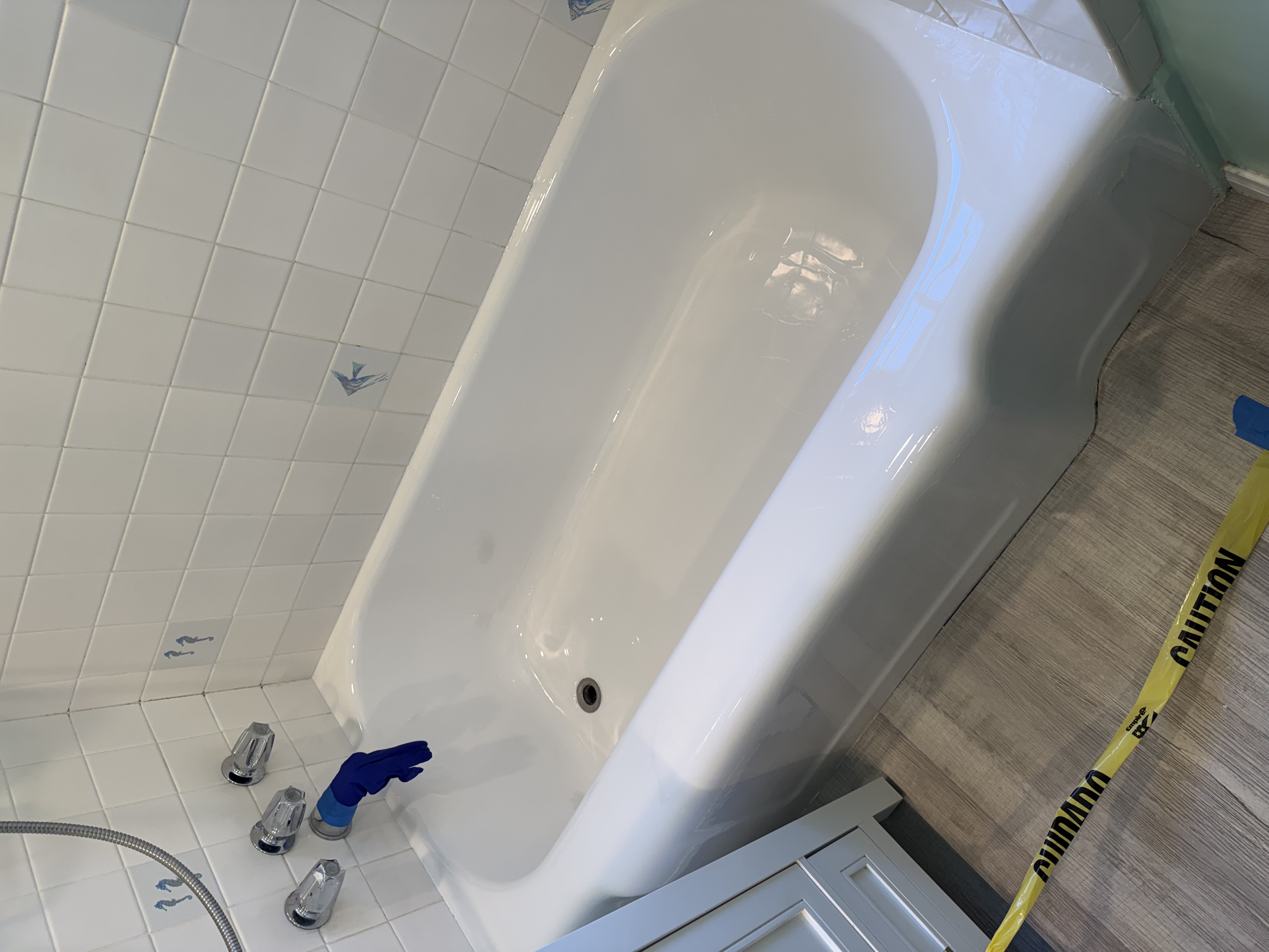 Completely refinished glossy white cast iron bathtub