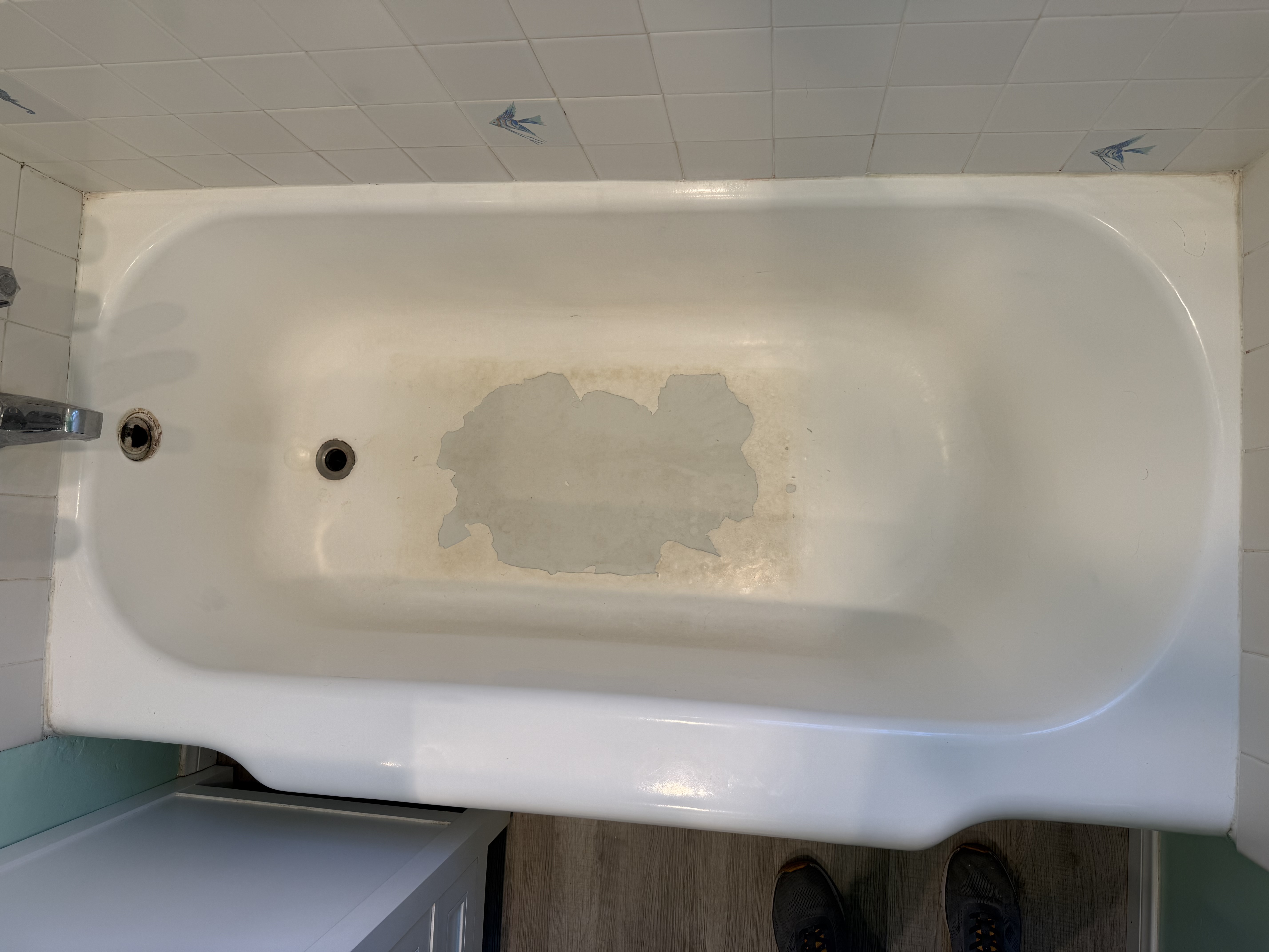 Stripping and sanding the bathtub surface