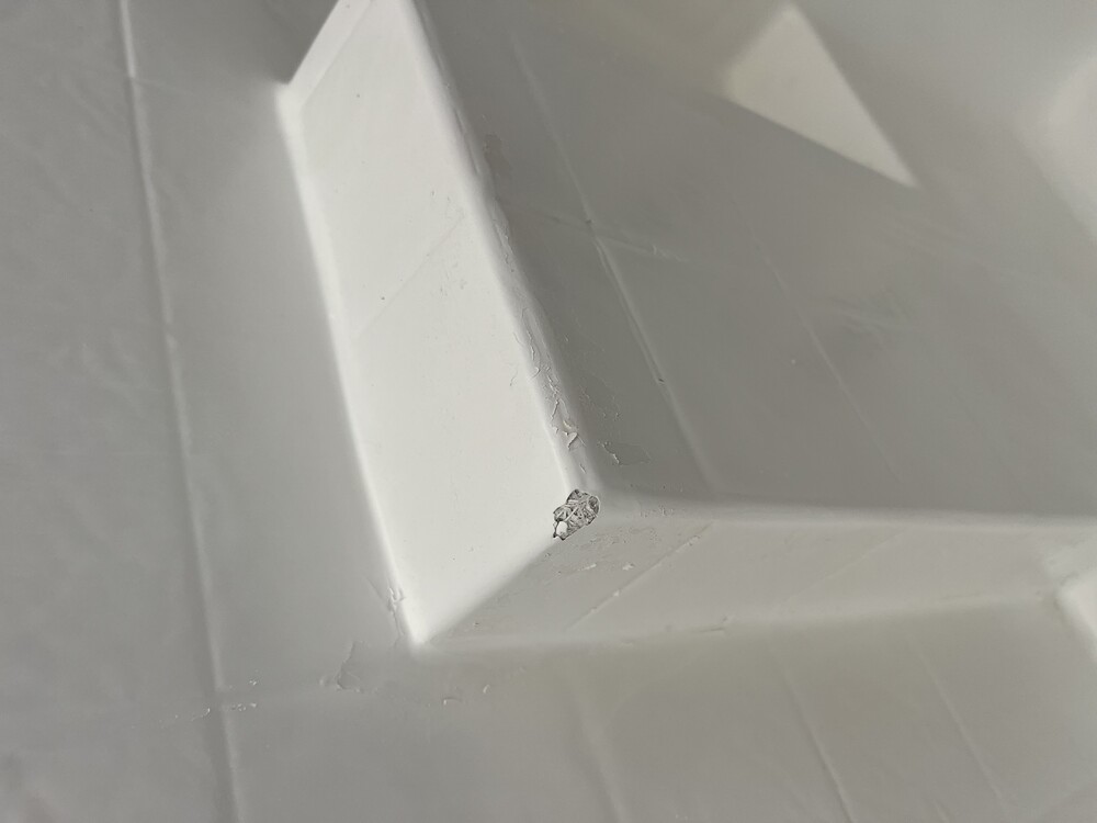 Peeling bathtub coating before repair
