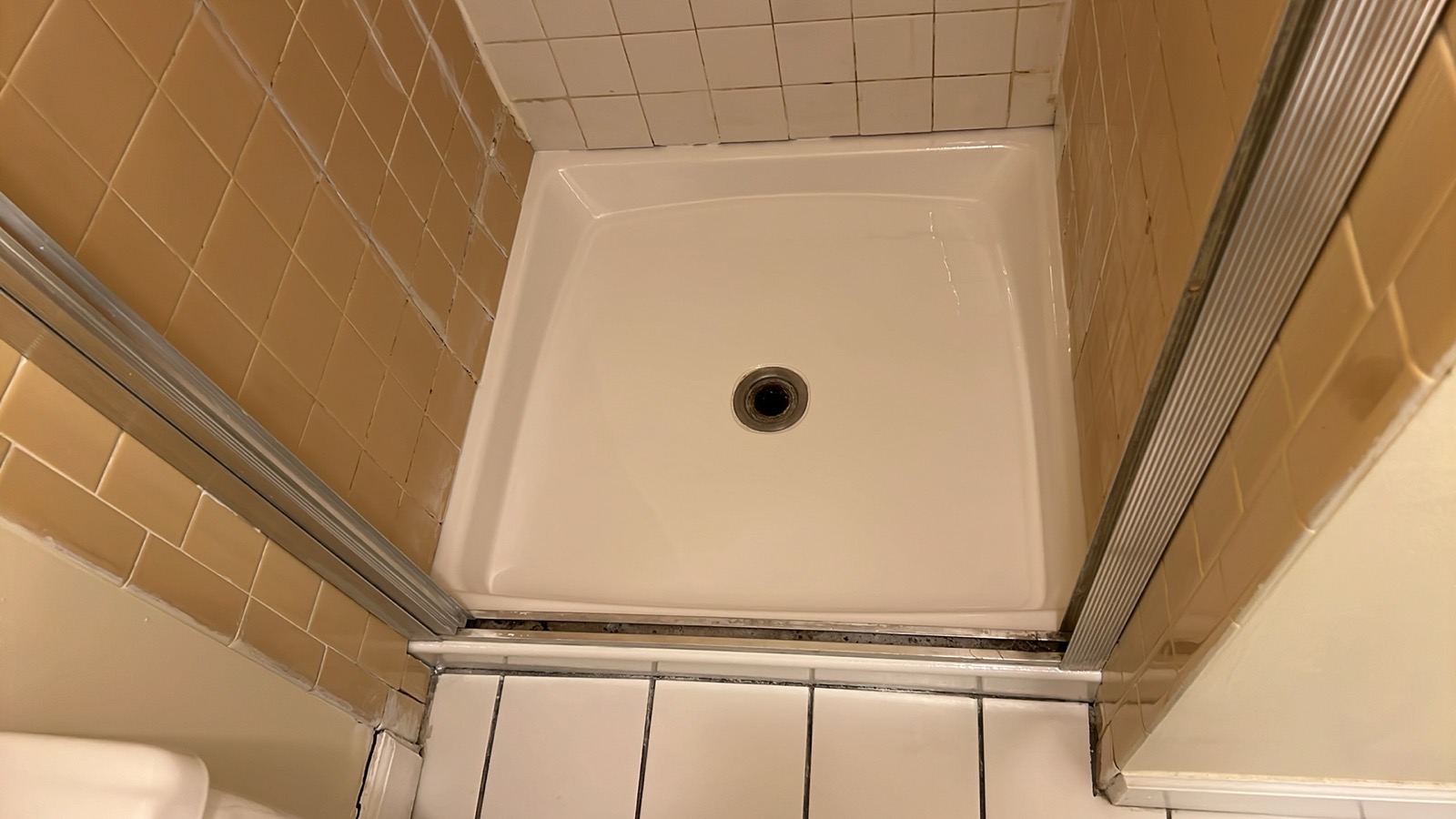 Beautifully restored bright white shower base after professional refinishing by Fresh Tub in Los Angeles
